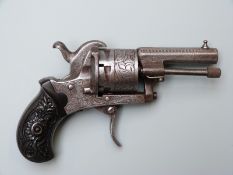 Belgian six shot pinfire hammer action revolver with engraved frame and cylinder, carved grips,