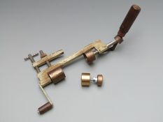10 bore shotgun cartridge reloading tool with wooden handles together with a brass 12 bore