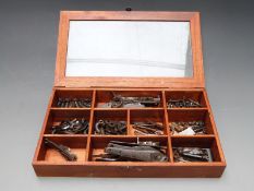 A collection of parts and spares including locks with one pair named Pritchard, hammer, nipples,