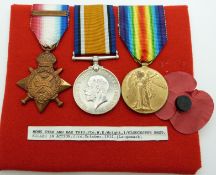 British Army WWI medals comprising 1914 'Mons' Star with clasp, War Medal and Victory Medal, named