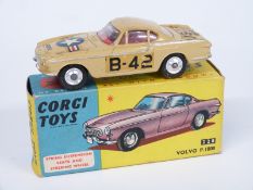Corgi Toys diecast model Volvo P.1800 with beige body, red interior and USAF military decals, in