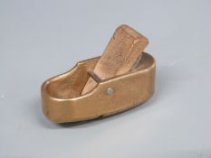 Small brass or bronze finger plane with double curved face, length 5cm