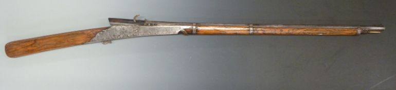 Middle Eastern matchlock gun with riveted steel lock plates, steel bands, brass tipped steel ram-