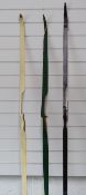 Three composite archery bows in cases including a 'Popular 64' by Border Bows of Kelso