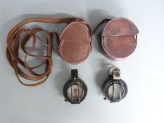 WWII two prismatic compasses, one by GEC no B 144249, dated 1939, the other by TG & Co Ltd,