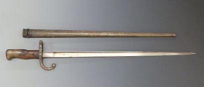French 1874 Model T bayonet with 52cm blade and stamped 97087 to the quillion, in metal scabbard.