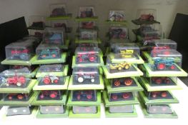 One-hundred Hachette 1:43 scale diecast model tractors, all in original bubble packed boxes.