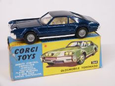 Corgi Toys diecast model Oldsmobile Toronado with metalic blue body and cream interior 264, in