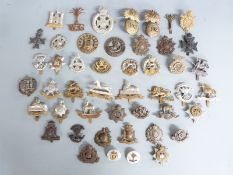 A collection of British Army cap badges, mainly Infantry regiments including The Queen's Regiment,