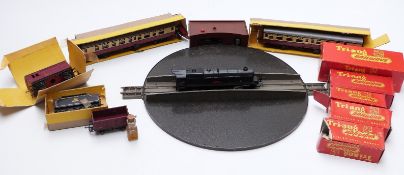 A collection of Tri-ang 00 gauge model railway locomotives, wagons, coaches etc., some in original