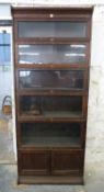 Globe Wernicke style glazed oak six division bookcase, the bottom piece being a two door cabinet.