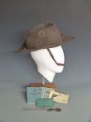 WWII Australian slouch hat with RAF badge, original cord, chin strap and leather interior marked