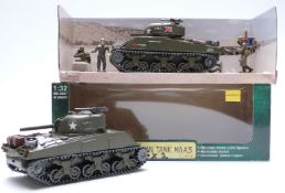 A collection of German and other model military vehicles and field guns, some in original boxes.