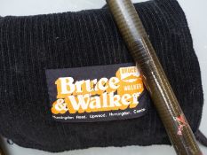 A three piece graphite 15' salmon fly fishing rod, probably Bruce and Walker and in named cloth bag