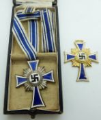 Two German Third Reich Nazi Mother's Cross of Honour medals / badges, one in box