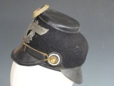 WWII German felt covered leather police shako with laced leather inner band