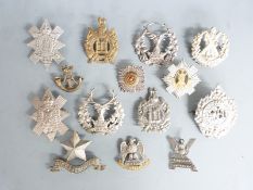 A small collection of British Army (Scottish) metal badges including Black Watch Argyll & Sutherland