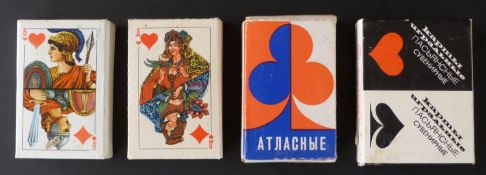 Three single and one double pack of modern Russian playing cards