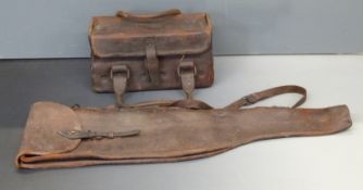 A brown leather leg of mutton gun carry case, 82cm long, with sling and carry handle together with a
