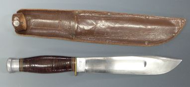 William Rodgers bowie knife with 20cm blade and banded handle, in leather scabbard.