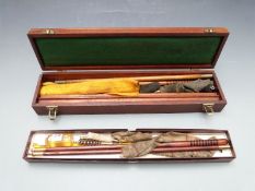 Two shotgun cleaning kits, one .410 in original box the other 12 bore in wooden case.