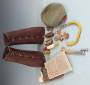 A collection of militaria to include Pentagon leather gaiters, two 'Lucifers', one dated 1914 and