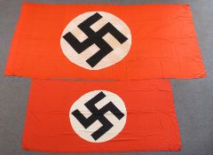A large Nazi flag, 145 x 300cm, together with a smaller example 96 x 200cm