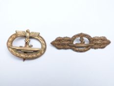 German Navy WWII submarine War Badge together with a submarine combat badge