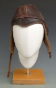 A peaked leather flying helmet