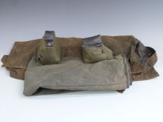 A weighted canvas gun stand together with two pairs of gentleman's over trousers.