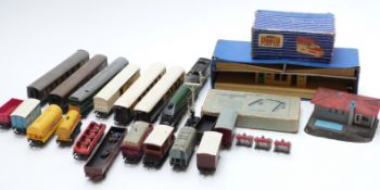 Thirty-one Hornby Dublo 00 gauge locomotives, coaches, wagons, buildings and accessories including