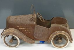 A vintage child's pedal car with opening doors, fold down windscreen and canvas seat, length