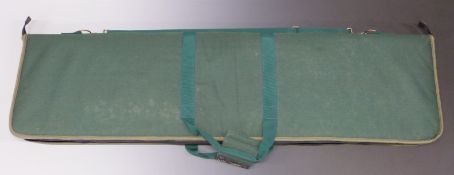 A padded canvas double gun carry case with additional pockets and shoulder strap, 126 x 34cm