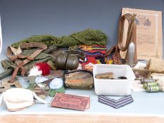 A small collection of militaria to include badges, buttons, first aid items, arm bands, ear