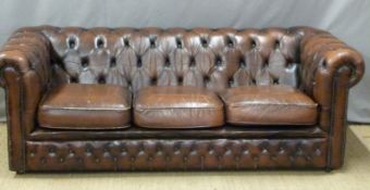 A brown leather Chesterfield sofa. W195 x D80 x H95