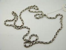A silver necklace made up of oval links