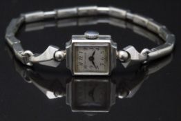 Wittnauer 14ct gold ladies wristwatch with blued hands, black Arabic numerals and silver dial, on
