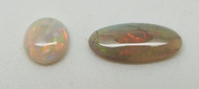 Two oval opal cabochons of approximately 1ct & 0.5ct and a round opal cabochon of approximately  0.