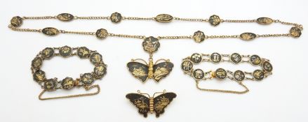 A suite of Japanese jewellery comprising butterfly brooch and pendant and two bracelets