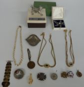 An enamelled crown, a white metal brooch, two Christian Dior necklaces, brooches etc