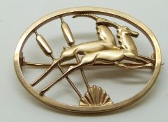 Geoffrey Bellamy for Ivan Tarratt 9ct gold brooch in the form of jumping gazelle and bulrushes