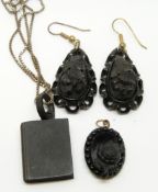 Two Victorian jet earrings, and two jet pendants, including one in the form of a book