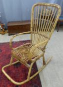 A cane/wicker rocking chair