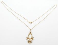 A 9ct gold pendant set with pearls, on a 9ct gold chain, 2.9g, 25cm drop