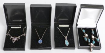 Four boxed silver necklaces including an amethyst Art Nouveau style example