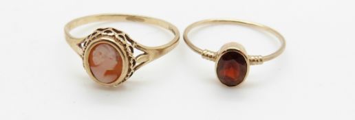 A 9ct gold ring set with an oval cut garnet and a 9ct gold ring set with a cameo, 2.4g
