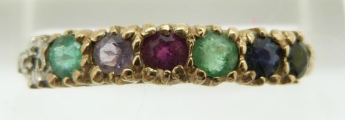 A 9ct gold ring set with a diamond, emerald, amethyst, ruby, emerald sapphire and tourmaline reading