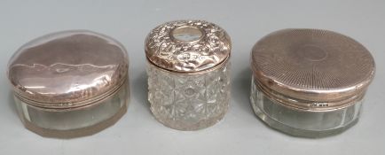 Three hallmarked silver lidded dressing table pots, diameter of largest 9cm