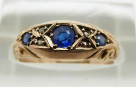 A 9ct gold Edwardian ring set with blue stones, Chester 1912, 1.8g, size M