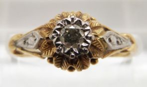 An 18ct gold ring set with diamond in a textured floral setting, 2.6g, size N